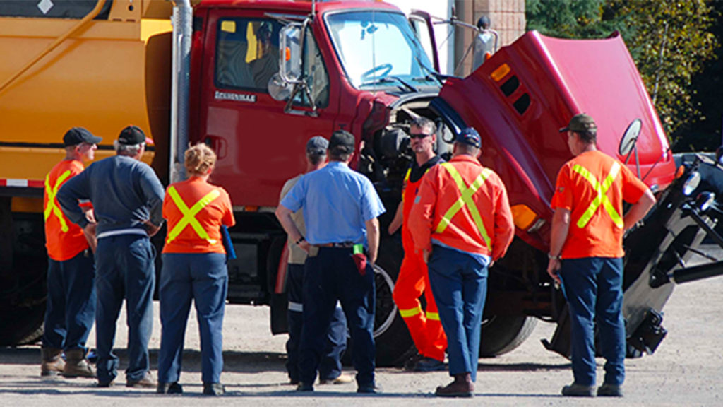 Ground Force instructor showing students how to perform a pre-trip inspection